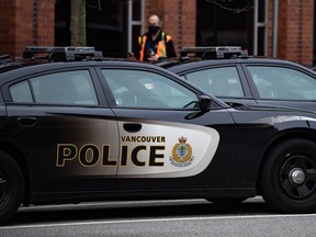 Police cars are seen parked outside Vancouver Police Department headquarters in Vancouver, on Saturday, Jan. 9, 2021. Vancouver Police say they have arrested 14 people at a protest by pro-Palestinian demonstrators who were blocking rail lines in East Vancouver.