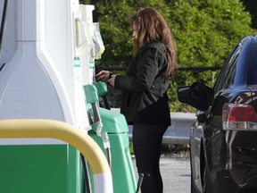 A customer prepares to purchase gas at a filling station in Chicago, Monday, April 22, 2024.