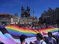 People march during a LGBTQ+ parade