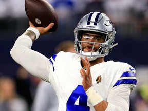 Quarterback Dak Prescott of the Dallas Cowboys warms up prior to the game against the Seattle Seahawks at AT&T Stadium on Nov. 30, 2023 in Arlington, Texas.