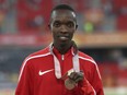 FILE - Men's 10,000m bronze medalist, Kenya's Rodgers Kwemoi on the podium at Carrara Stadium during the 2018 Commonwealth Games on the Gold Coast, Australia, on April 14, 2018. Kenyan 10,000-meter runner Rodgers Kwemoi was banned for six years on Friday May 17, 2024 for suspected blood doping and disqualified from Olympics and world championships races.