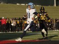 Argonauts quarterback Cameron Dukes runs in a touchdown during first half CFL pre-season action against the Hamilton Tiger-Cats in Guelph, Ont., Friday, May 31, 2024.