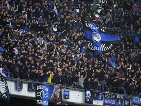Fans cheer prior the start of the Europa League semifinal first leg soccer match between Olympique de Marseille and Atalanta at the Velodrome stadium in Marseille, France, Thursday, May 2, 2024.