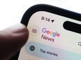 The Google News homepage is displayed on an iPhone in Ottawa on Tuesday, Feb. 28, 2023. Google is taking Canada's broadcasting regulator to court, arguing "significant" revenues it earns from advertisements on Youtube videos shouldn't be considered when it comes to the fees it owes the CRTC.
