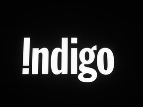 An Indigo bookstore sign is illuminated on a store front in Ottawa, Tuesday, March 30, 2021.