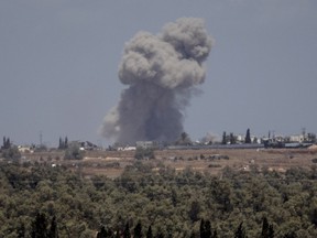 Smoke rises over the southern part of the Gaza Strip after an Israeli bombardment, as seen from the Israeli side from the border on May 7, 2024 in Southern Israel.