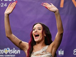 Eden Golan representing Israel with the song "Hurricane," reacts during a press conference after qualifying for the final during the second semifinal of the 68th edition of the Eurovision Song Contest at the Malmo Arena, in Malmo, Sweden, Thursday, May 9, 2024.