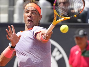 Rafael Nadal, of Spain, returns the ball to Hubert Hurkacz, of Poland, during their match at the Italian Open tennis tournament in Rome, Saturday, May 11, 2024.
