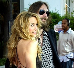Actress Kate Hudson and then husband Chris Robinson arrive at the premiere of "Skeleton Key" at Universal Studios Cinema at Universal City Walk on August 2, 2005 in Universal City, California.
