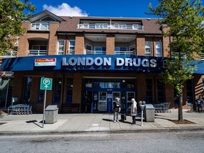 People wait outside of London Drugs