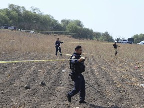 Police tape off the area where volunteers said they have found a clandestine crematorium in Tlahuac, on the edge of Mexico City, Wednesday, May 1, 2024. Ceci Flores, a leader of one of the groups of so-called "searching mothers" from northern Mexico, announced late Tuesday that her team had found bones around clandestine burial pits and ID cards, and prosecutors said they were investigating to determine the nature of the remains found.