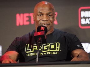 FILE - Mike Tyson speaks during a news conference promoting his upcoming boxing bout against Jake Paul, May 16, 2024, in Arlington, Texas. Tyson was recovering Monday, May 27, after suffering a medical emergency a day earlier during a flight from Miami to Los Angeles, his representatives said. The 58-year-old boxing legend "became nauseous and dizzy due to an ulcer flare up 30 minutes before landing" his publicist's office said in a statement.