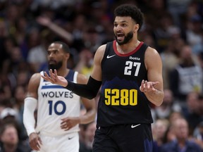 Canadian Jamal Murray #27 of the Denver Nuggets looks for a foul call while playing the Minnesota Timberwolves in the second quarter during Game Two of the Western Conference Second Round Playoffs at Ball Arena on May 06, 2024 in Denver, Colorado.