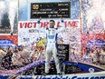 FILE - Kyle Larson (5) celebrates in Victory Lane after winning the NASCAR All-Star Cup Series auto race at North Wilkesboro Speedway, Sunday, May 21, 2023, in North Wilkesboro, N.C.