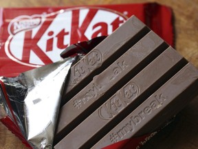 A Kit Kat chocolate bar is photographed Wednesday July 25, 2018, in Rugby, England. Hundreds of Nestle workers walked off the job in Toronto on Sunday after their union said the company wouldn't budge on pension improvements.