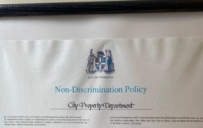 A poster of the City of Toronto non-discrimination policy, removed from St. Lawrence Hall