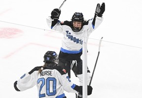 Toronto's Sarah Nurse (20) celebrates with teammate Emma Maltais after scoring against Montreal during overtime at the Bell Centre in Montreal, Saturday, April 20, 2024.