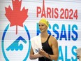 Summer McIntosh smiles as she walks off the pool deck after winning the women's 400m freestyle at the Canadian Olympic Swim Trials in Toronto on Monday May 13, 2024.