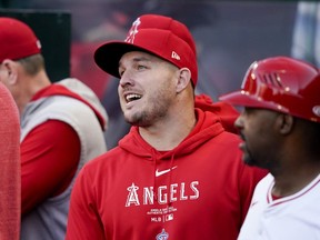 Los Angeles Angels star Mike Trout speaks with teammates