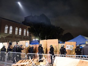 California Highway Patrol (CHP) officers clear a pro-Palestinian encampment after a dispersal order was given at the University of California, Los Angeles (UCLA) campus, on May 2, 2024 in Los Angeles.