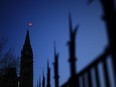 Almost 60 per cent of Canadians feel free speech is under threat, with nearly one in four who considers that threat to be serious, a new poll suggests. The Canada flag catches the morning light on the Peace Tower on Parliament Hill in Ottawa on Tuesday, April 16, 2024.