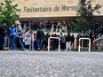 Prison officers gather and block the entrance of the "Baumettes" penitential centre in Marseille, south-eastern France, on May 15, 2024.
