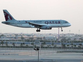This file photo taken on June 12, 2017 shows a Qatar Airways plane landing at the Hamad International Airport in the Qatari capital Doha.