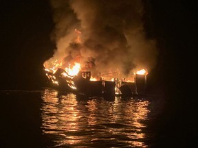 a boat burns off the coast of Santa Cruz Island, California