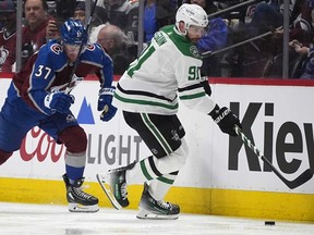 Dallas Stars centre Tyler Seguin, right, collects the puck next to Colorado Avalanche centre Casey Mittelstadt during the second period of Game 3 of an NHL hockey Stanley Cup playoff series Saturday, May 11, 2024, in Denver.