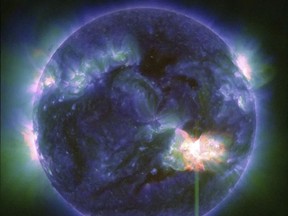 Space Weather Canada is warning the public that a "major geomagnetic storm" alert is in effect Friday, which might cause "ionospheric disturbances." This image provided by NASA shows a solar flare, as seen in the bright flash in the lower right, captured by NASA on Thursday, May 9, 2024.