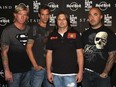 From left to right: Jon Wysocki, Johnny April, Mike Mushok and Aaron Lewis of Staind poses at an event marking the release of "The Illusion of Progress" at the Hard Rock Cafe in Times Square on Aug. 19, 2008 in New York City.
