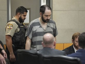Daniel Perry enters the courtroom