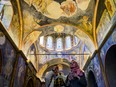 Visitors take picture inside the ancient Orthodox church now converted as the Kariye Mosque in Istanbul, on May 6, 2024.