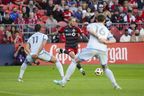 Toronto FC forward Federico Bernardeschi scores as CF Montreal forward Ariel Lassiter (left) and defender Joel Waterman defend Saturday night. THE CANADIAN PRESS/Chris Katsarov