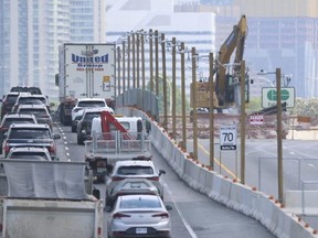 Drivers navigate the Gardiner Expressway Strategic Rehabilitation project at the Dufferin Street bridge on Sunday May 21, 2024.   Jack Boland/Toronto Sun/Postmedia Network