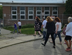Community members gathered to walk Eitan Cohen, 13 (white T-shirt and black shorts), to his school – Faywood Arts-Based Curriculum School – in North York to ensure the Jewish boy didn't get bullied on Friday, May 17, 2024.