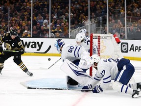 Brad Marchand of the Boston Bruins takes a shot against Joseph Woll of the Maple Leafs during the third period of Game 5 at TD Garden on April 30, 2024 in Boston.