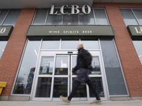 A person walks past an LCBO in Ottawa.