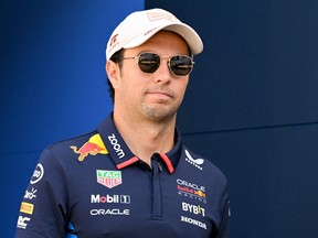Red Bull Racing driver Sergio Perez walks in the paddock ahead of the Formula One Monaco Grand Prix.