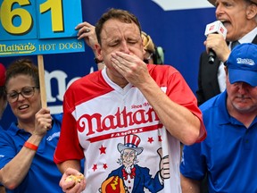 Defending champion Joey Chestnut competes in the 2023 Nathan's Famous Fourth of July International Hot Dog Eating Contest in 2023.