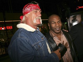 Pro wrestler Hulk Hogan and boxer Mike Tyson arrive at a movie premiere in 2005.