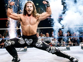 WWE wrestler Shawn Michaels hits his signature pose.