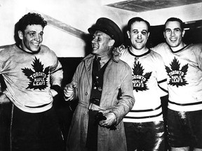 From left: Pete Langelle, Conn Smythe, Dave 'Sweeney' Schriner and Lorne Carr of the Maple Leafs following a game in Toronto in April 19, 1942.