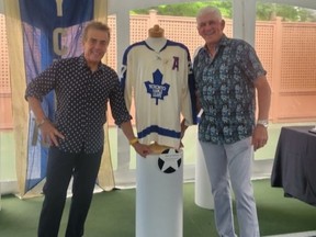 Appraiser Mike Wilson and former Leaf Rick Vaive with Sittler sweater at Thursday’s Studio Auctions event.