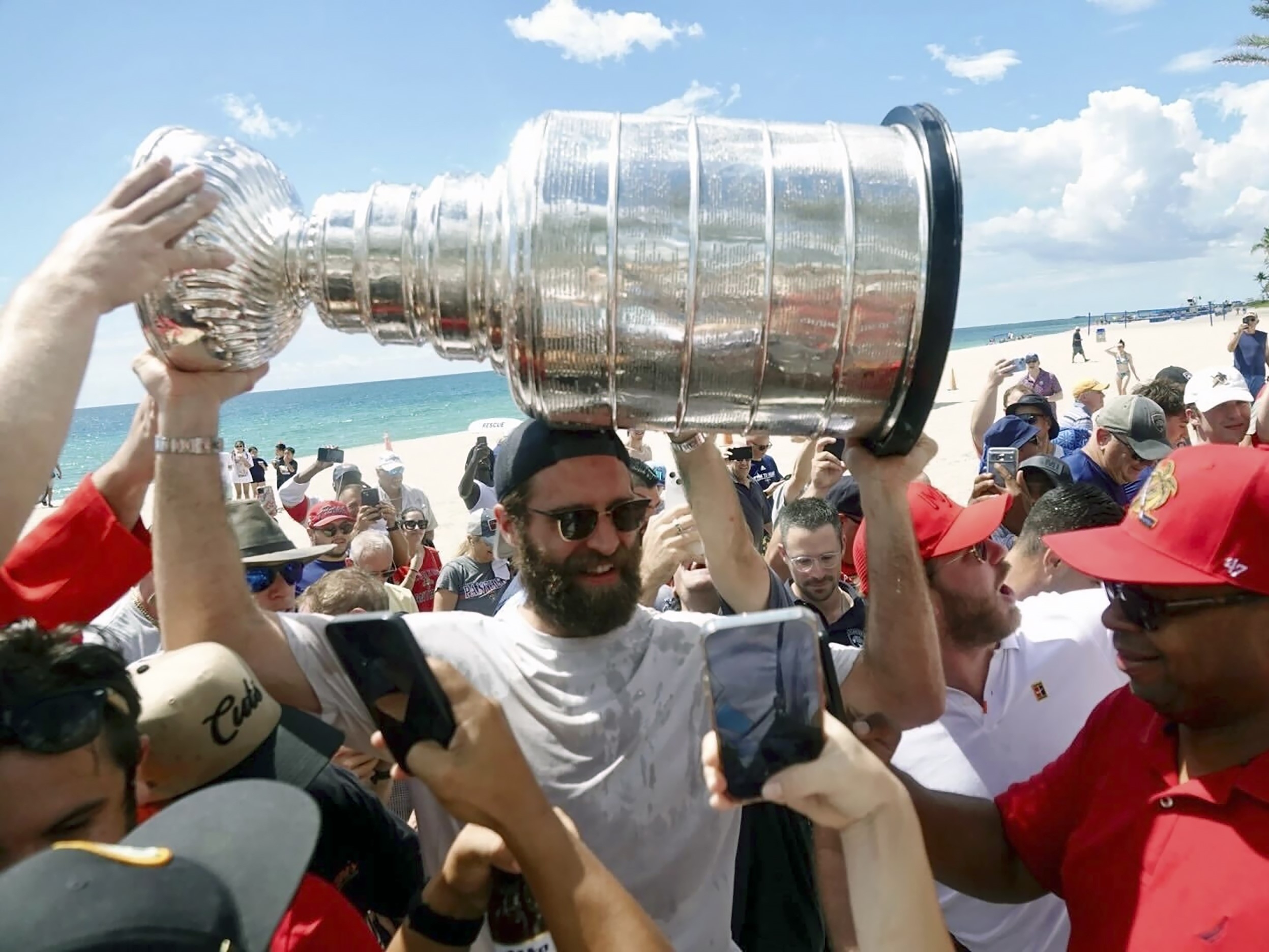 Florida Panthers' Aaron Ekblad carries the Stanley Cup in Fort Lauderdale, Fla.