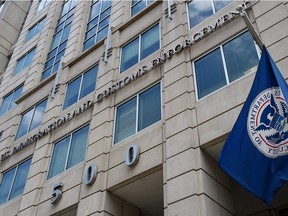 In this file photo taken on July 17, 2020 the Department of Homeland Security flag flies outside the Immigration and Customs Enforcement (ICE) headquarters in Washington, DC.