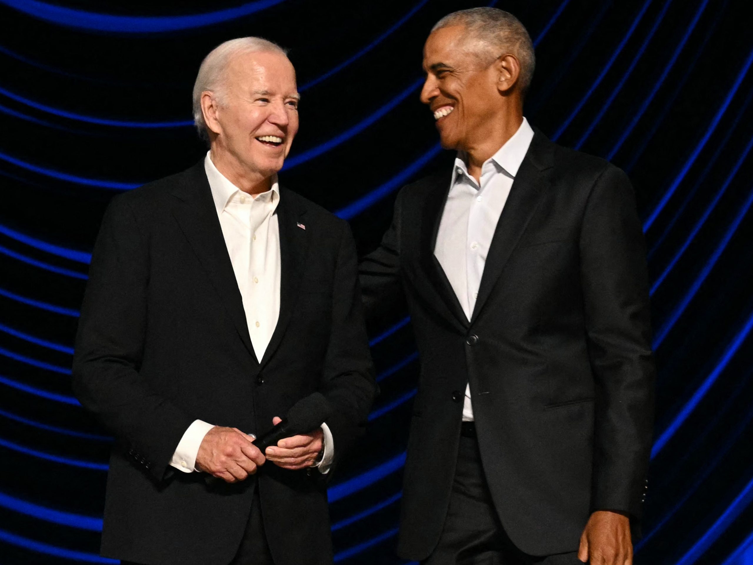  U.S. President Joe Biden stands with former President Barack Obama onstage during a campaign fundraiser at the Peacock Theater in Los Angeles on June 15, 2024.