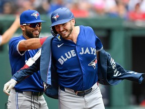 Spencer Horwitz and Isiah Kiner-Falefa of the Toronto Blue Jays celebrate a solo home run.