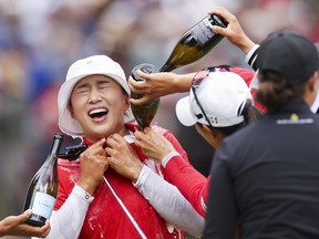 Amy Yang of South Korea is doused with champagne.