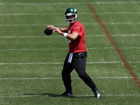Quarterback Aaron Rodgers of the New York Jets throws the ball during offseason workouts at Atlantic Health Jets Training Center in Florham Park, N.J., June 4, 2024.